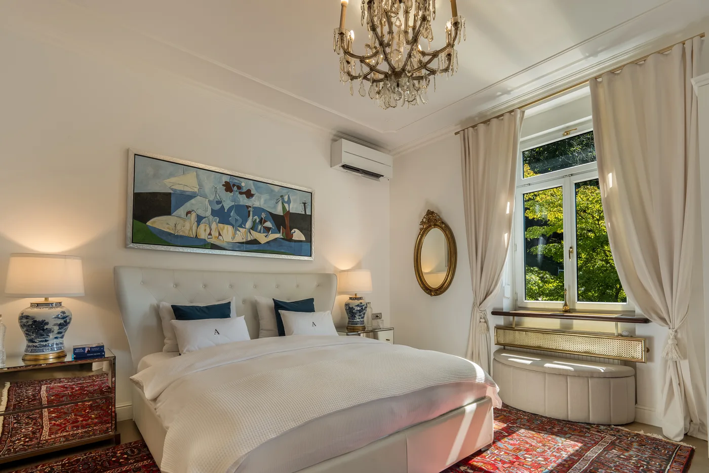 King-size bed and lake-facing window in the Luxury King Room