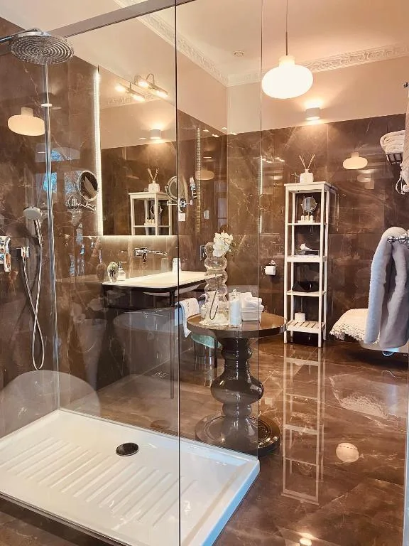 Prestige Suite bathroom with a glass shower enclosure