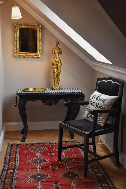 Writing desk beneath the sloping ceiling in the Suite with Lake View