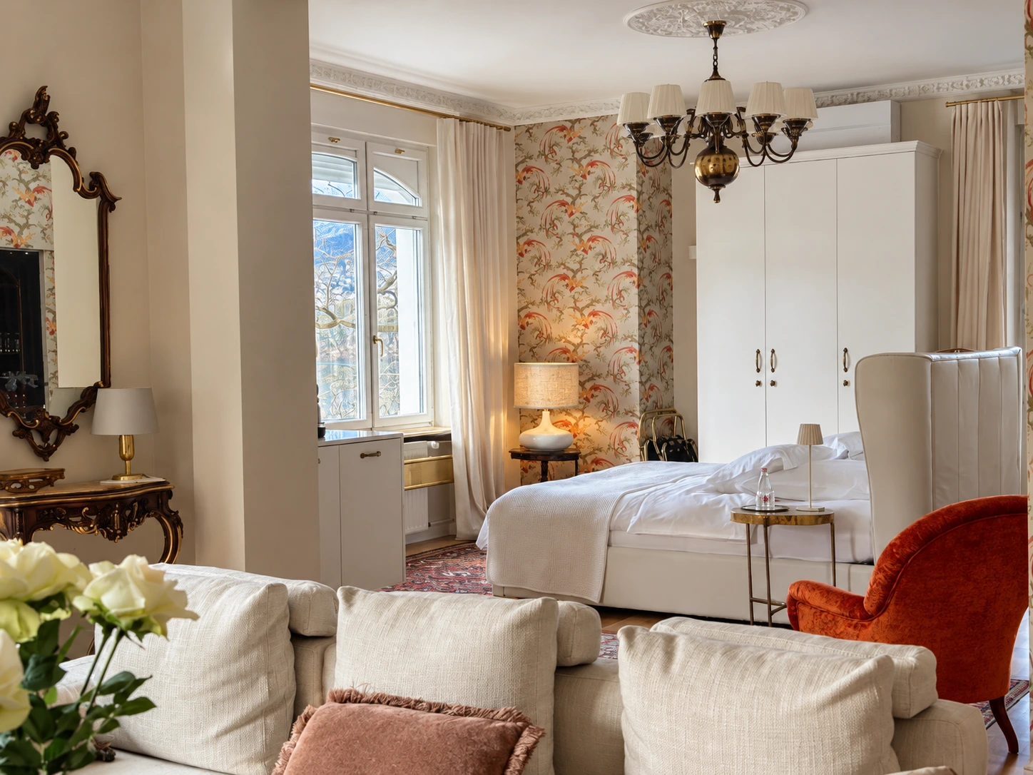 Prestige Suite bedroom and seating area beside the lake-facing windows