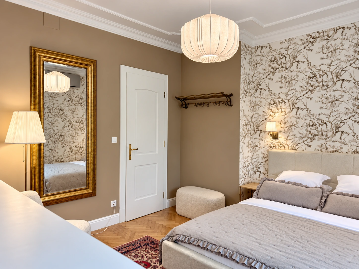 Double Room with a queen-size bed and botanical wallpaper